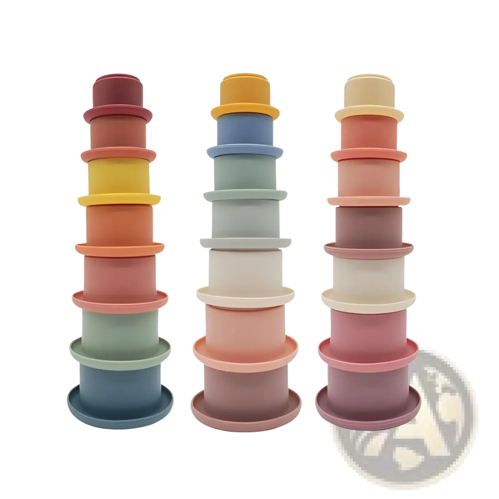 Three stacks of pastel-colored silicone stacking cups with gradient hues and matte finish educational baby toy