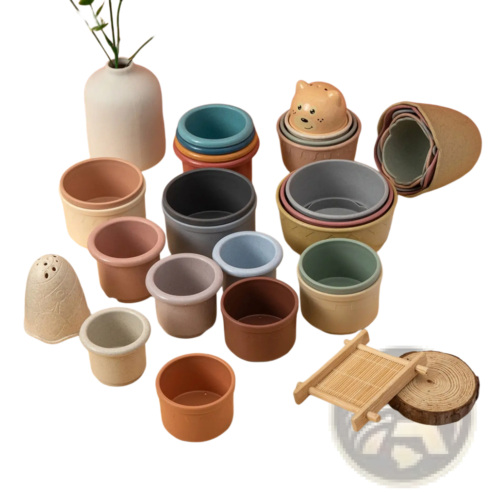 A set of pastel-colored silicone stacking cups with a bear-shaped lid designed as an educational nesting baby toy