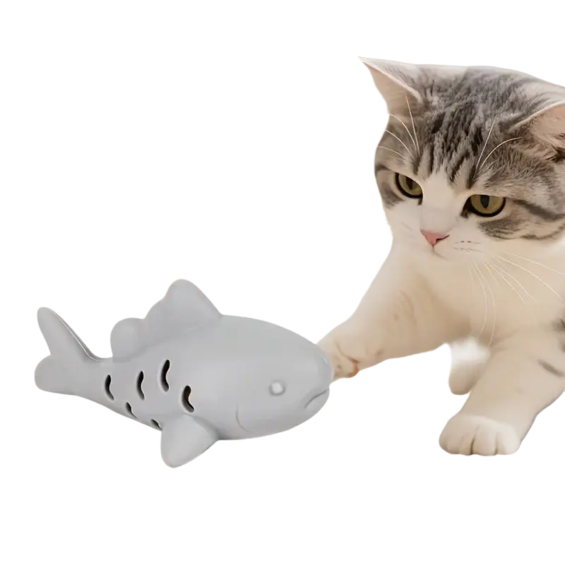 Gray silicone shark-shaped treat dispensing fish toy with perforated sides and small white eye detail for small pets