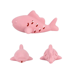 Pink silicone shark-shaped treat dispensing fish toy with perforated body and rounded fins for small pets
