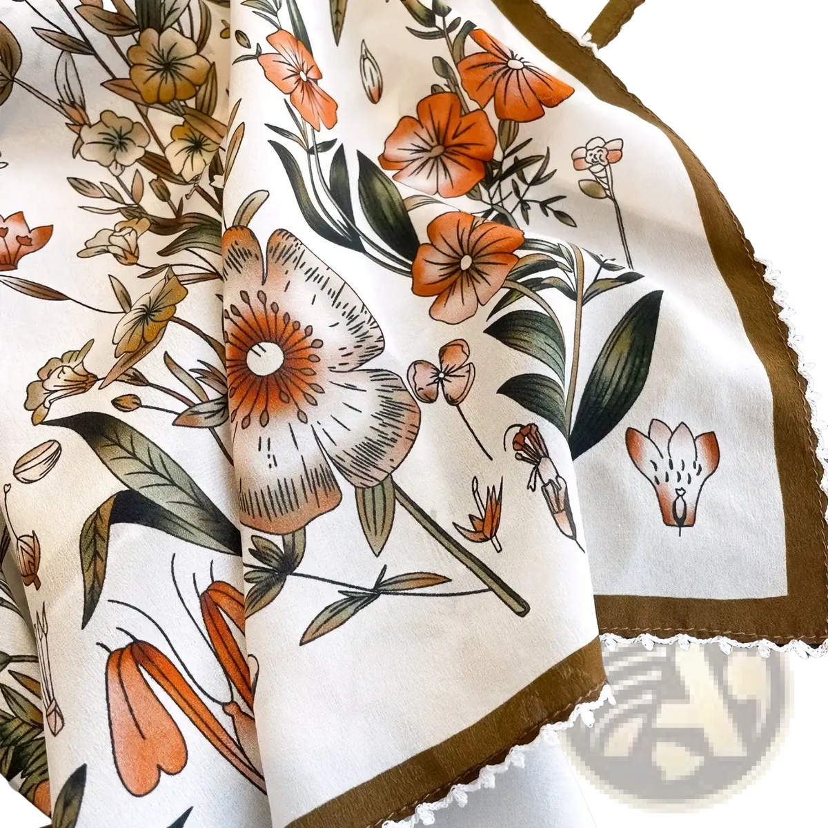 A cream-colored silk floral square scarf with orange peach and green botanical print brown border and white lace trim