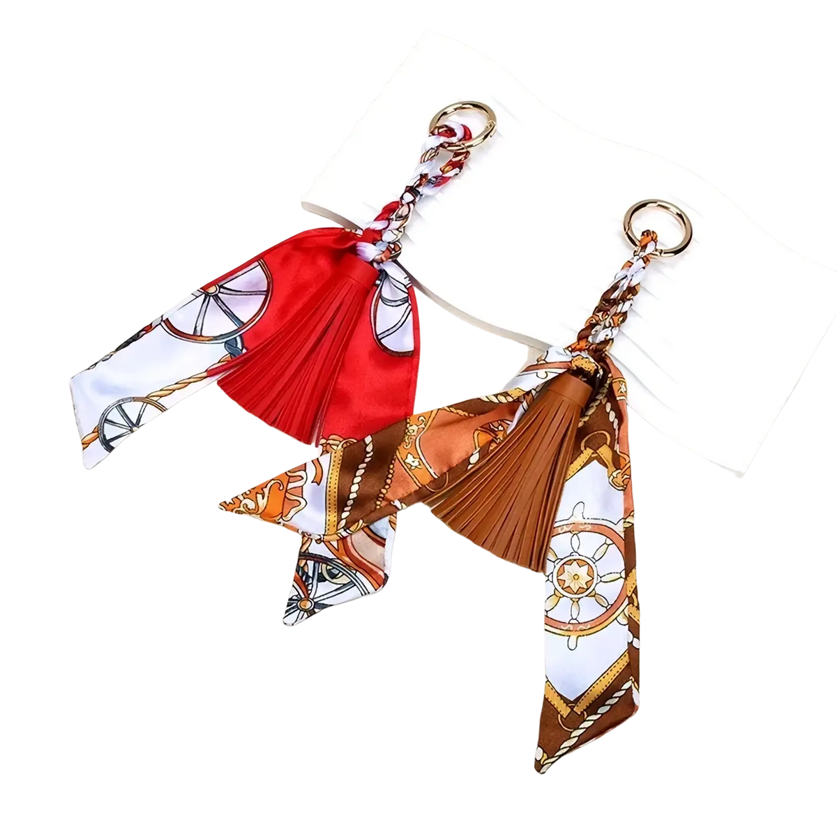 Two nautical-themed silk scarf tassel keychains in red and brown white with ship wheel and rope patterns for bags