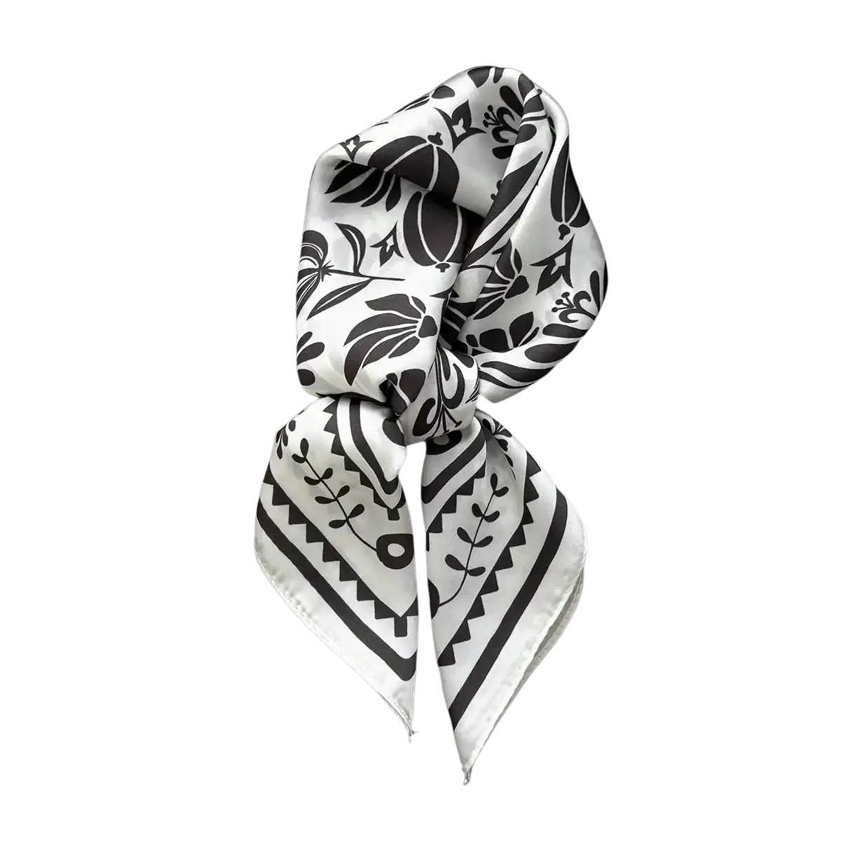 A white silk square scarf with bold black floral and geometric pattern tied as an elegant hair band neckerchief