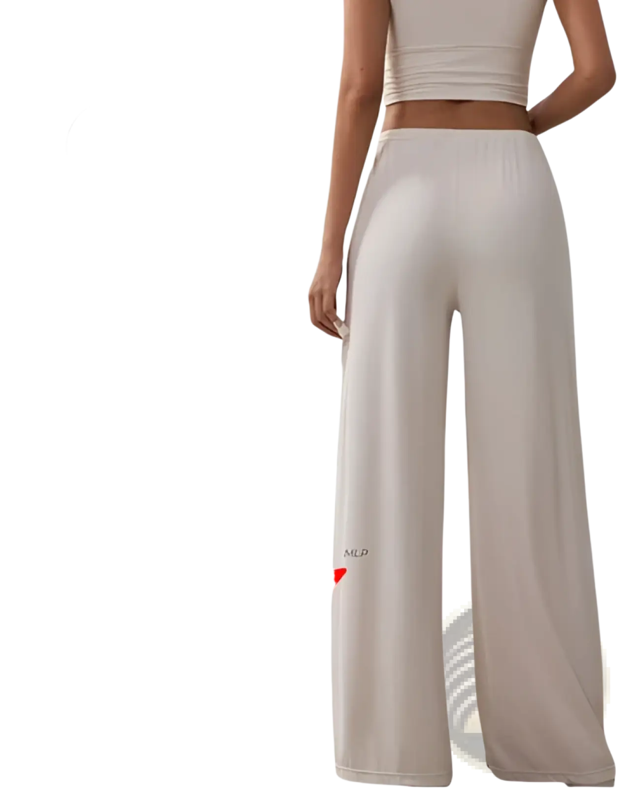 Beige silk wide leg yoga pants with silver silicone mlp logo on the lower leg featuring a relaxed fit