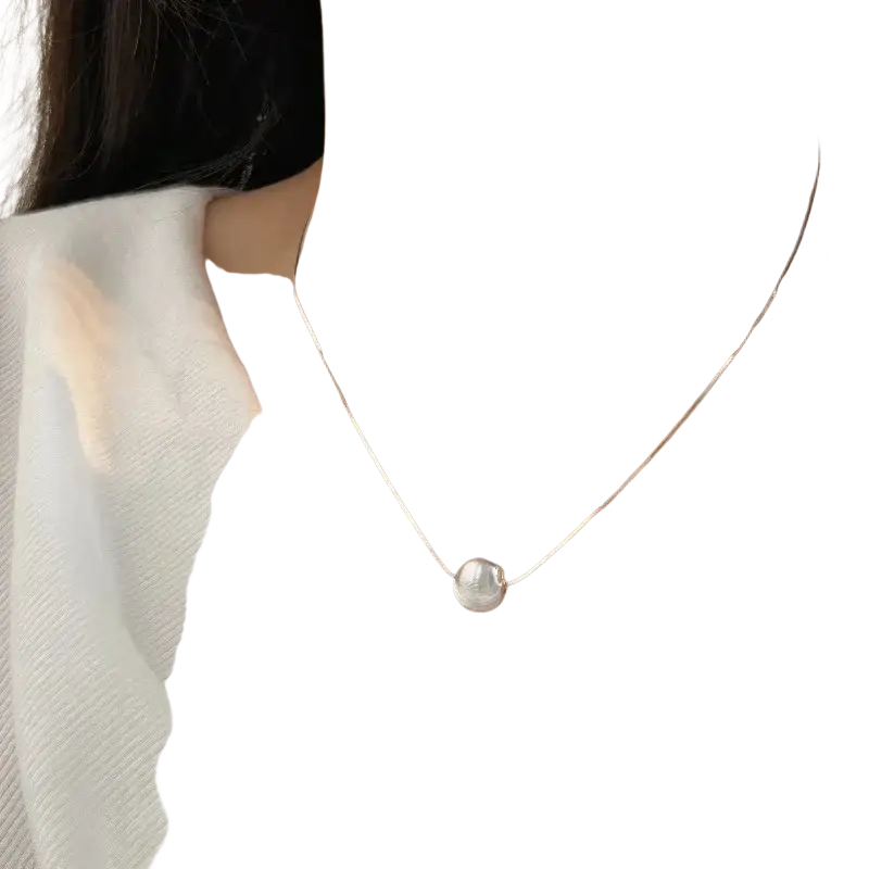 Silver bead pendant necklace featuring a delicate silver chain with a single lustrous white pearl pendant
