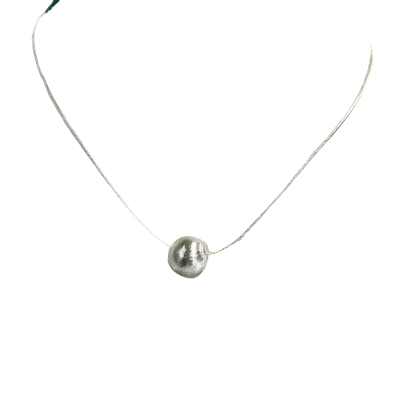 Silver bead pendant necklace featuring a textured spherical silver pendant on a minimalist fine chain
