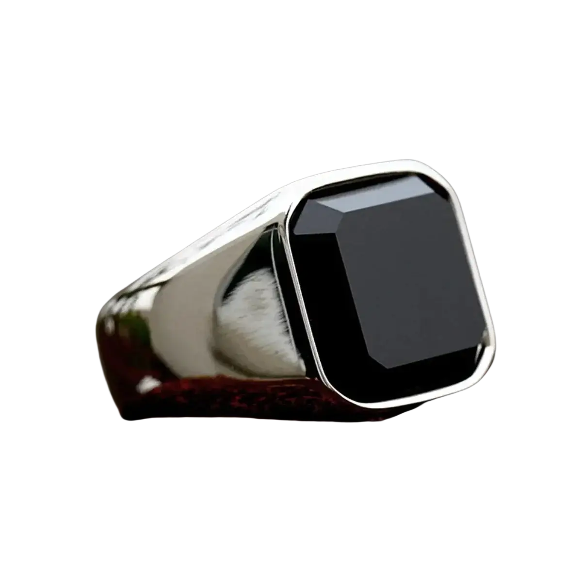 A sleek silver black onyx signet ring for men and women with a square-cut stone set in a polished band