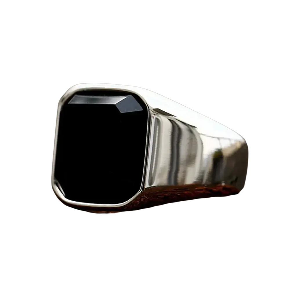 A sleek silver signet ring for men and women featuring a prominent square-cut black onyx stone