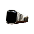 A sleek silver signet ring for men and women featuring a prominent square-cut black onyx stone