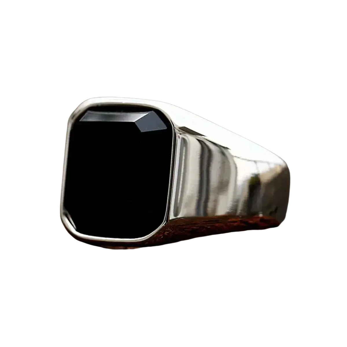 A sleek silver signet ring for men and women featuring a prominent square-cut black onyx stone