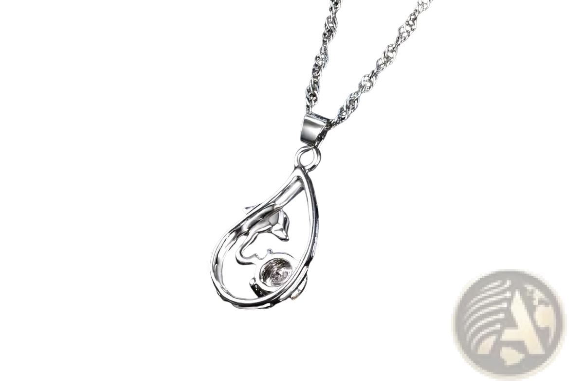 Silver teardrop-shaped sterling silver bridal necklace pendant with intricate openwork stylized face and small stone