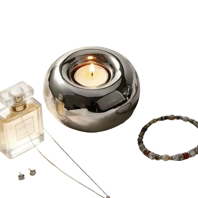 Silver ceramic sphere candle holder with shiny silver metallic smooth rounded reflective surface