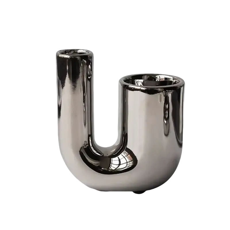 Silver ceramic sphere candle holder with a shiny metallic u-shaped design and reflective chrome-like finish