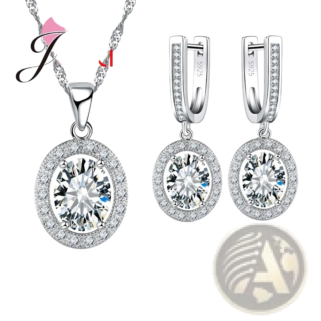 Silver crystal jewelry set featuring a silver-toned oval pendant necklace and matching hoop earrings with clear stones