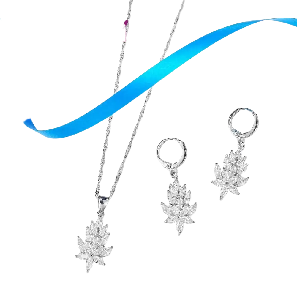 Silver crystal leaf jewelry set by yameli featuring silver leaf-shaped pendant necklace and matching earrings with clear crystals