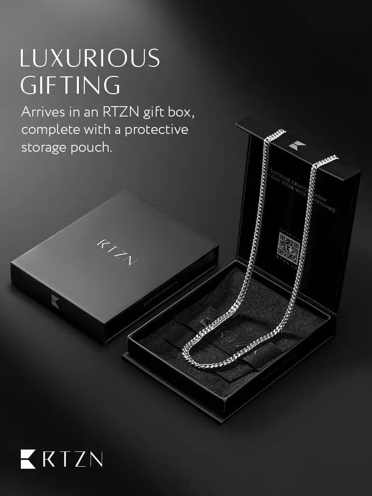 Silver 3.5mm diamond cut Cuban link chain necklace displayed in a black rtzn gift box