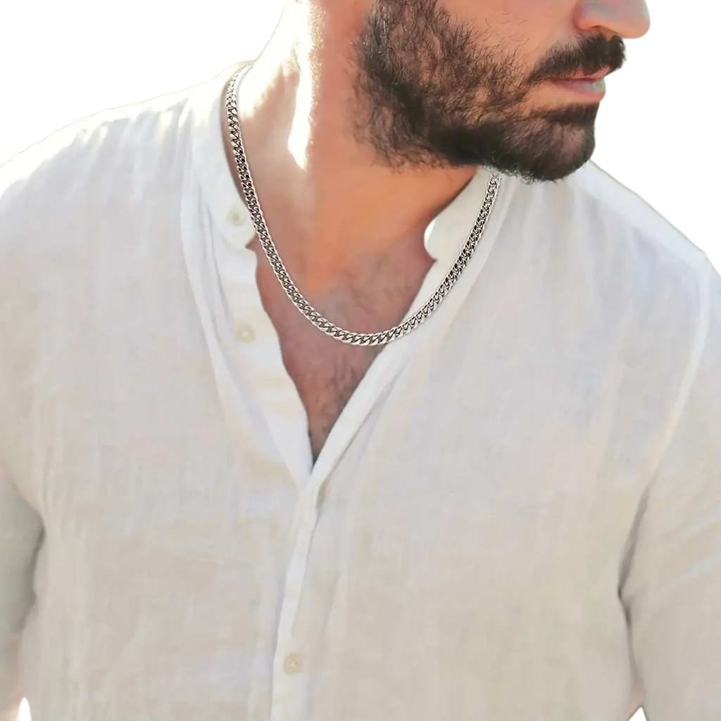 Silver-toned curb chain necklace for men showcasing a silver cuban link chain worn around the neck