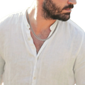 Silver-toned curb chain necklace for men showcasing a silver cuban link chain worn around the neck