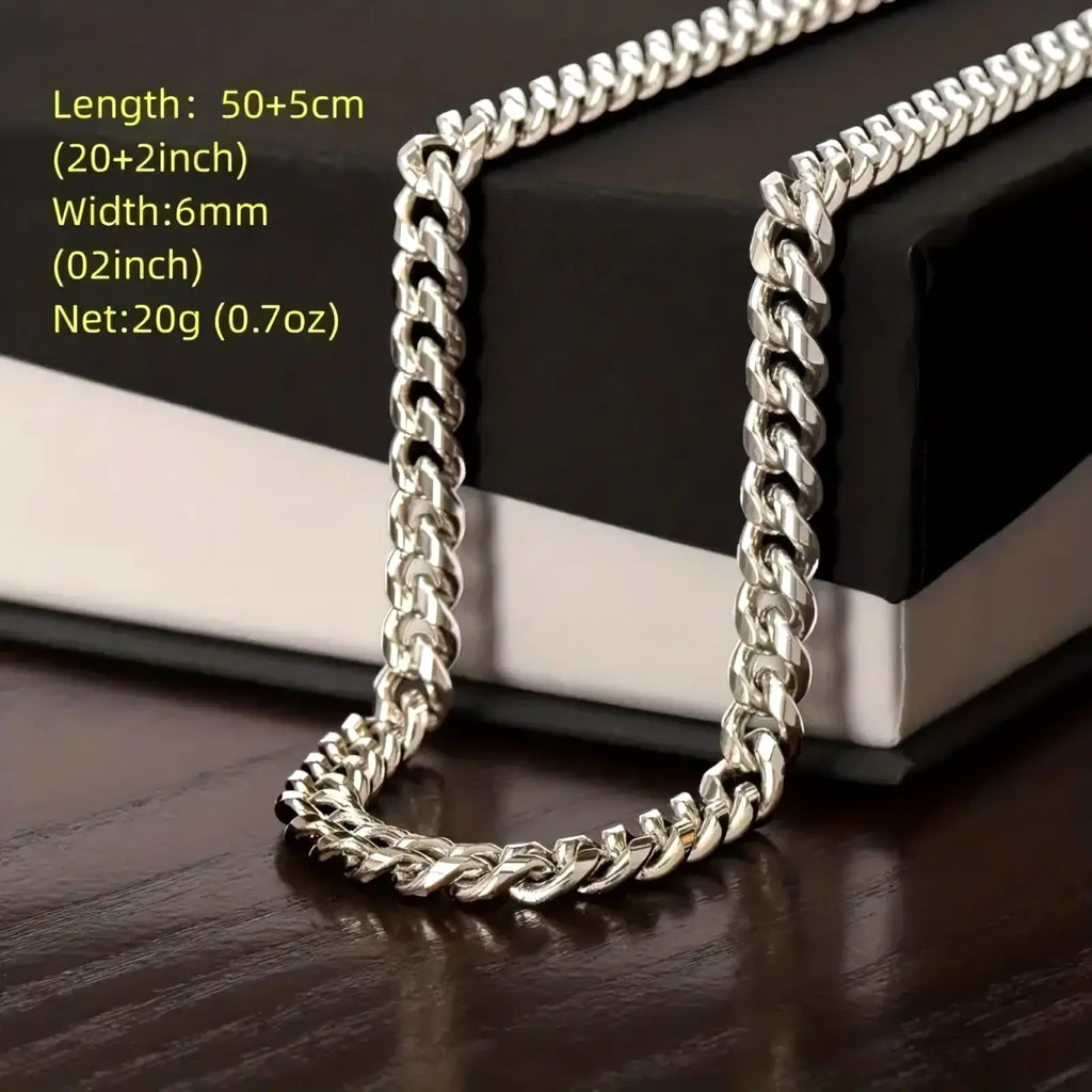 Silver Cuban link chain necklace for men featuring a bold, silver-toned stainless steel curb link design