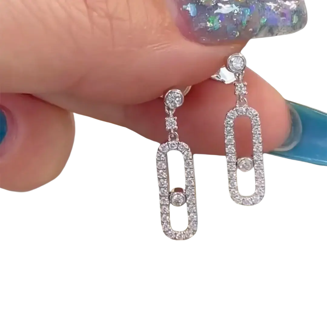Elegant silver diamond rectangle drop earrings with an open-frame design and central sparkling diamond accent