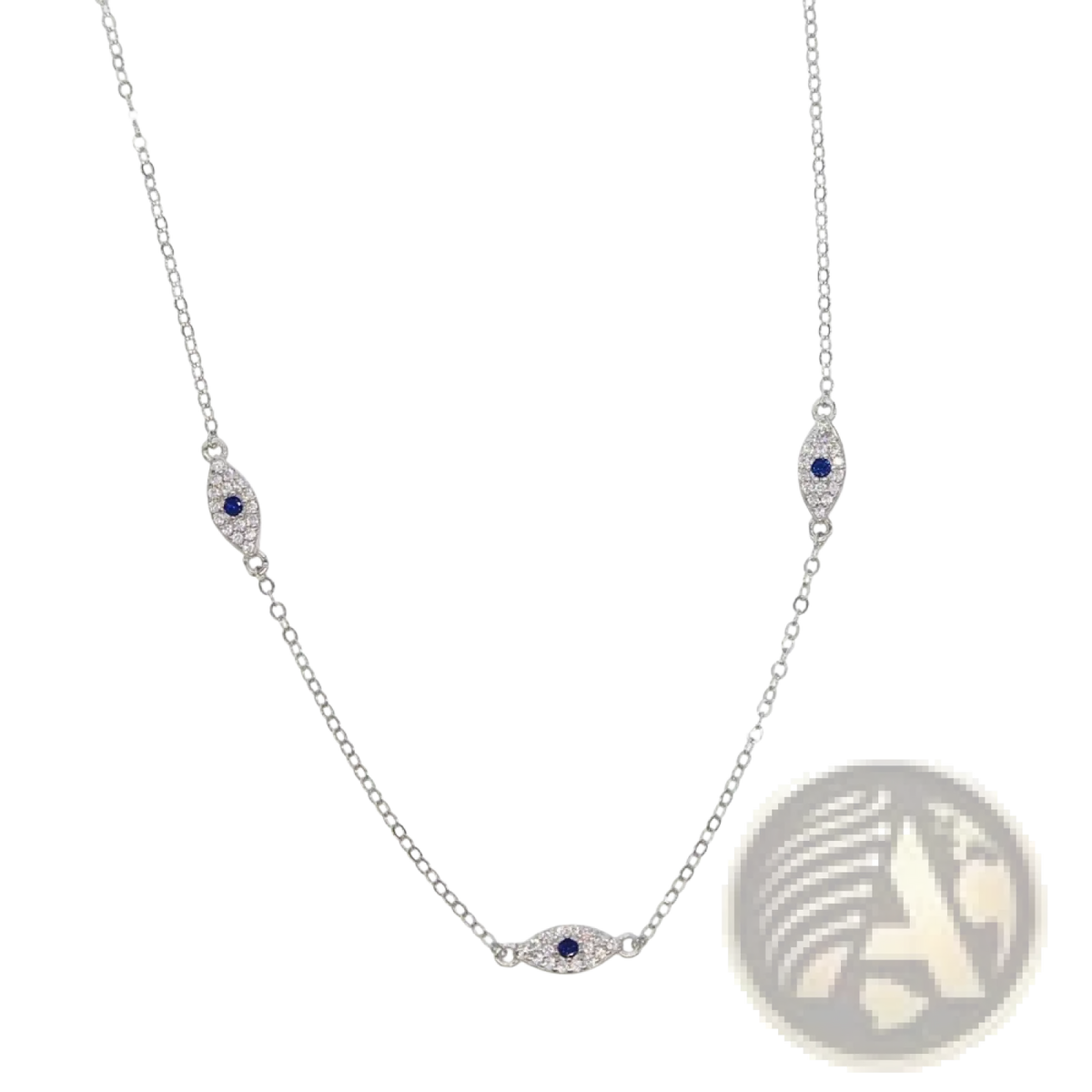 Silver evil eye charm necklace featuring a delicate silver chain with three blue sapphire and cz crystal pendants
