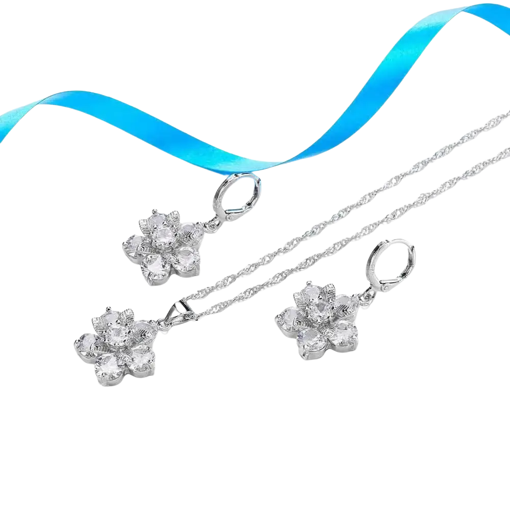Silver floral cz bridal jewelry set featuring silver pendant necklace and matching earrings with clear crystal stones