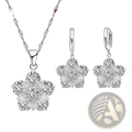 Silver floral cz bridal jewelry set featuring a silver pendant necklace and matching earrings with clear stones