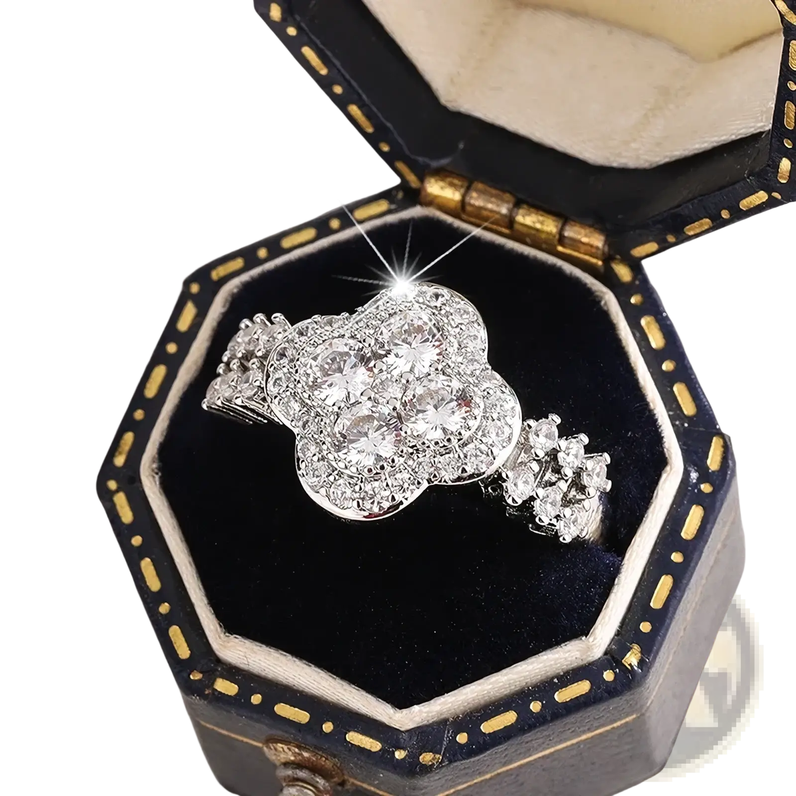 Silver four leaf clover engagement ring with clear cubic zirconia stones in a black and gold octagonal box