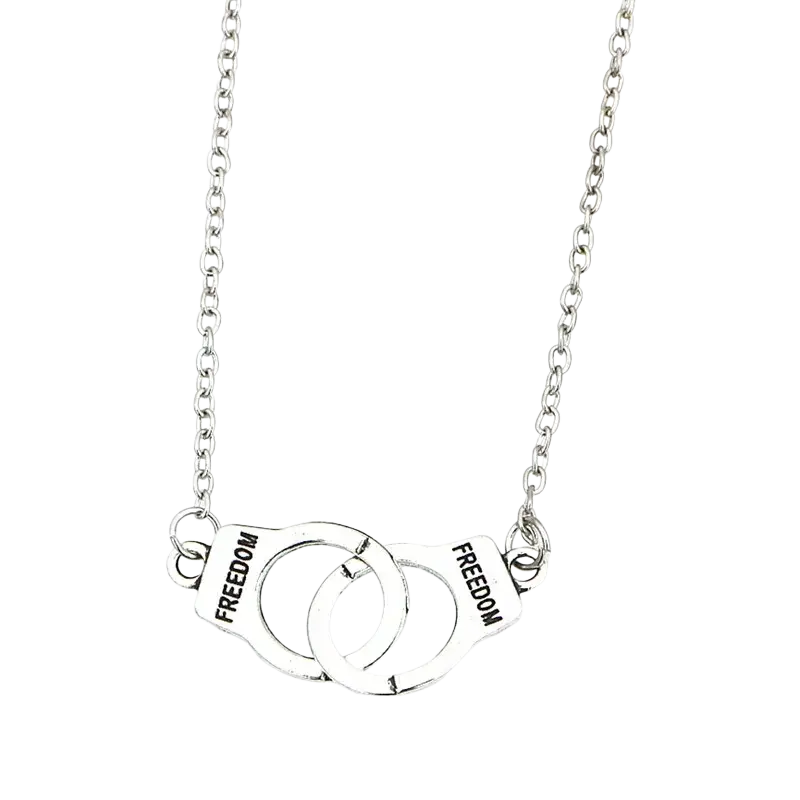 Silver handcuff freedom pendant necklace in fashion jewelry featuring engraved freedom on each cuff in silver tone