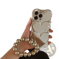 Silver heart electroplating iPhone case back with three overlapping heart mirrors and matching beaded wrist strap