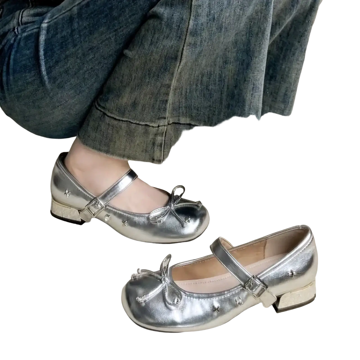 Silver mary jane flats featuring metallic material with bow and star embellishments for stylish wear