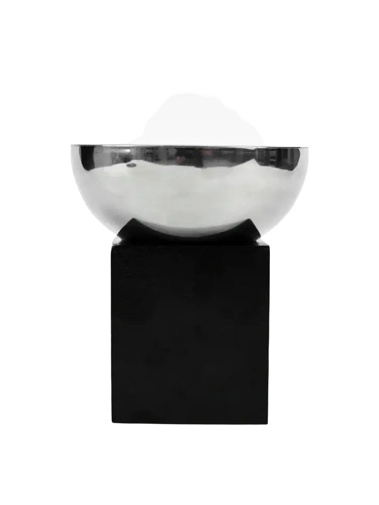 Silver metallic aromatherapy bowl with a shiny finish resting on a black rectangular base for elegant display