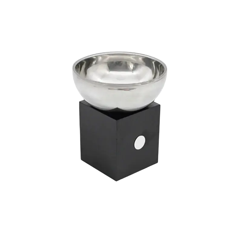 Silver metallic aromatherapy bowl with shiny finish resting on a sleek black square base with a circular white accent
