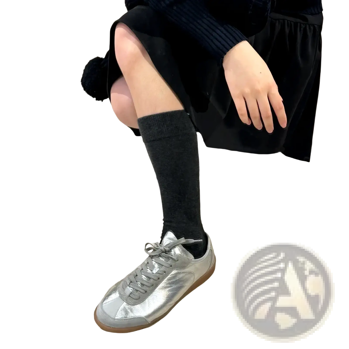 Silver metallic leather casual low-top sneaker with gray laces and tan rubber sole for everyday wear