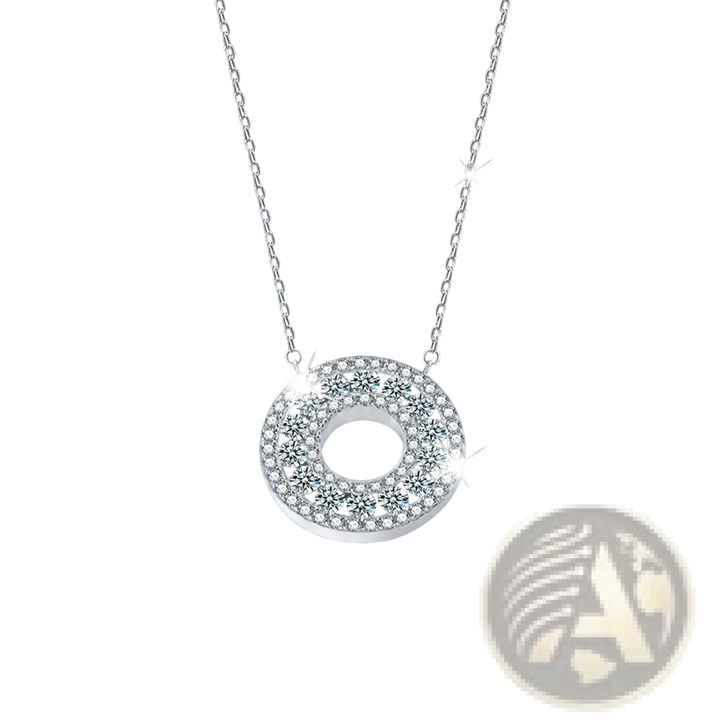 A silver moissanite halo pendant necklace with a circular pendant featuring clear faceted crystals in a sleek frame