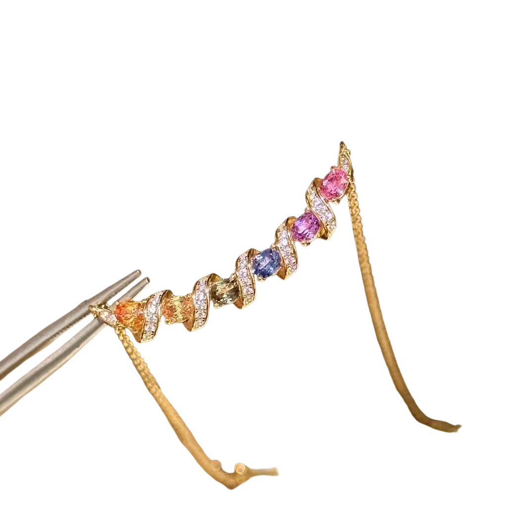Delicate silver necklace with a spiral gold pendant adorned with colorful gemstones and sparkling diamonds
