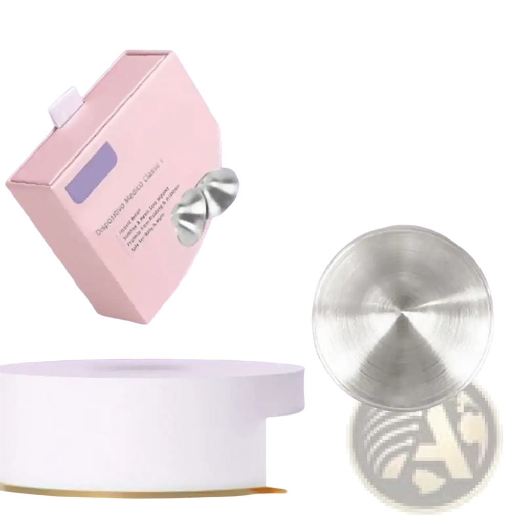 Silver metallic facial massage discs displayed in a pink box for breastfeeding healing nipple shields