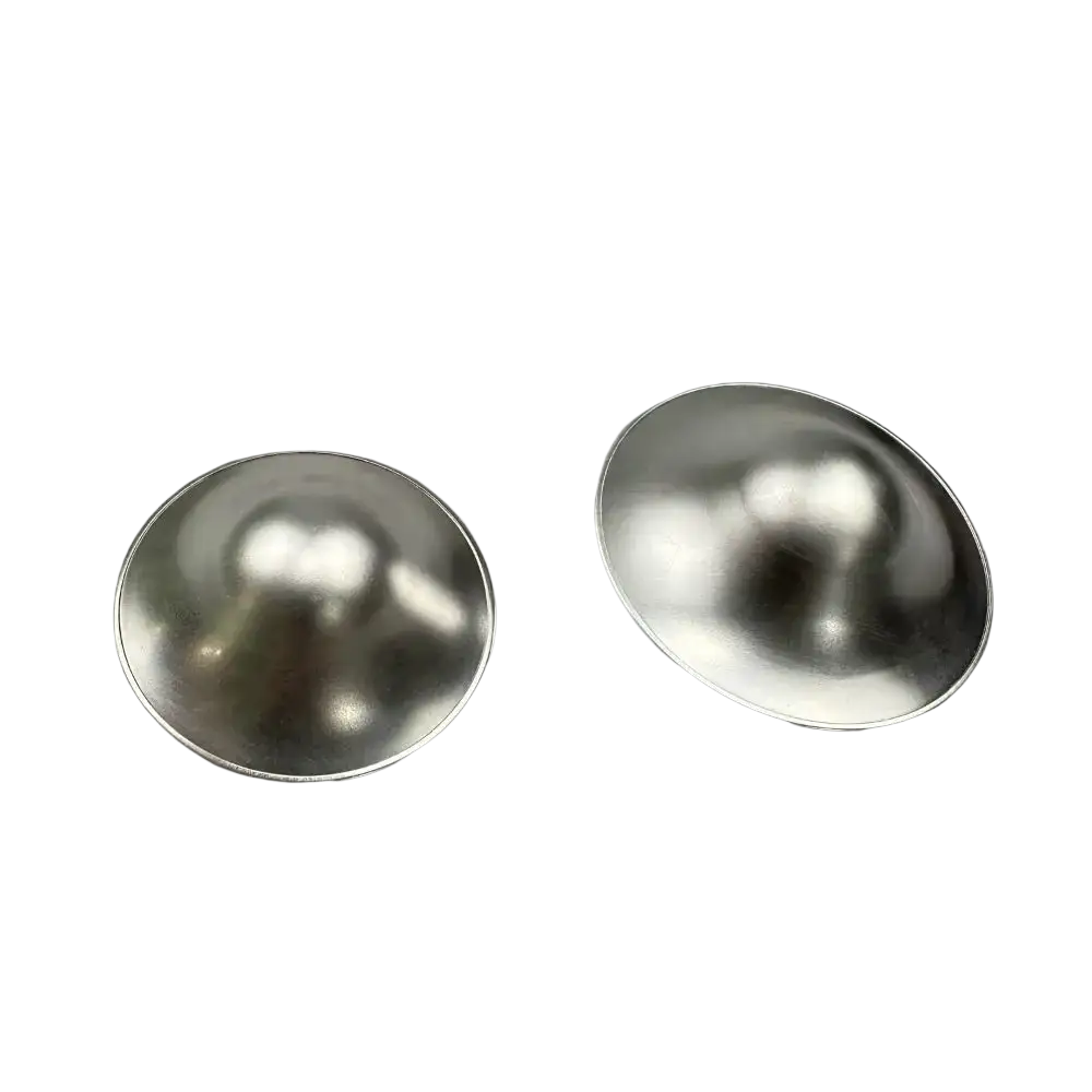 Two shiny metallic silver nipple shields with smooth reflective surface for breastfeeding healing use