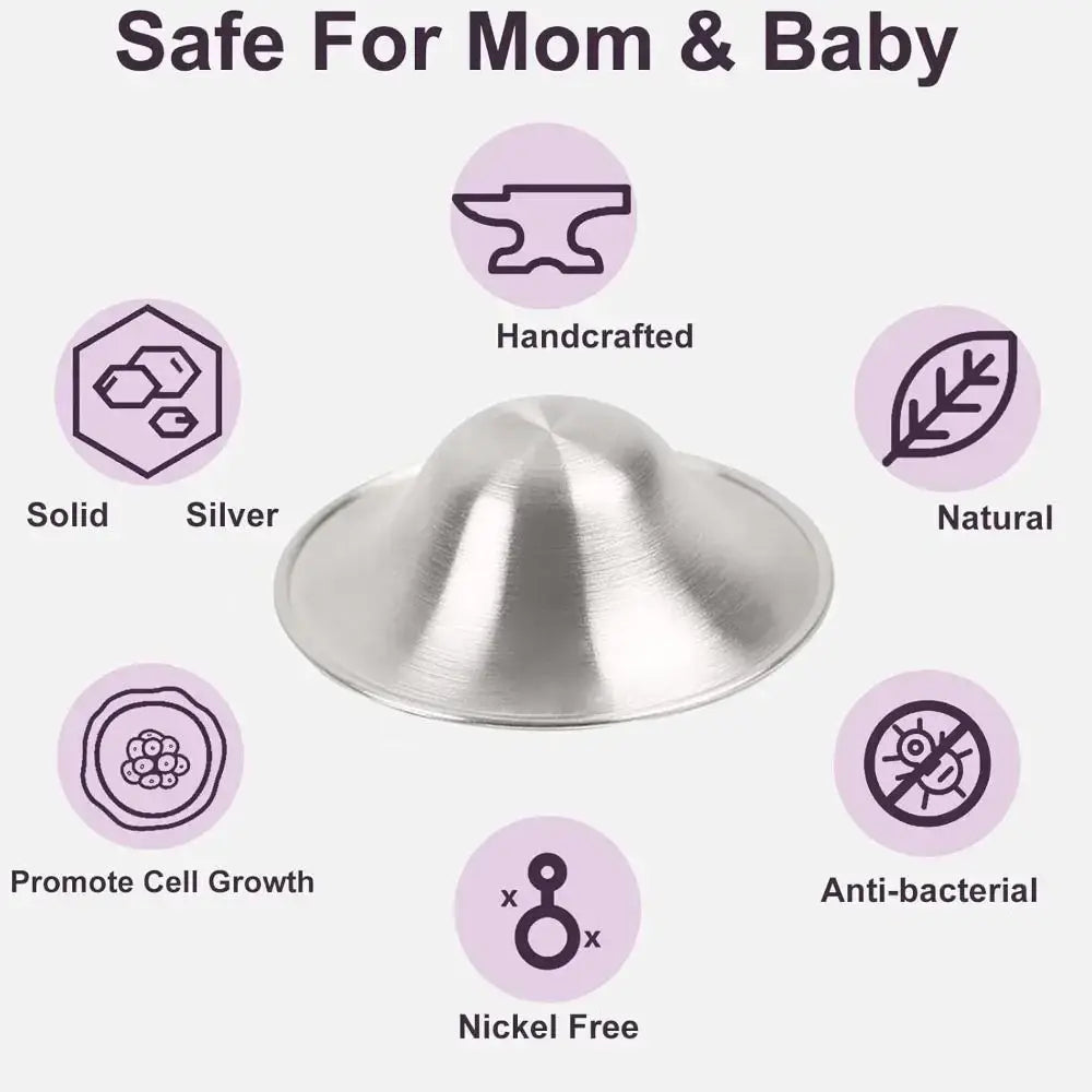 A sleek dome-shaped solid silver nipple shield with polished metallic finish for soothing breastfeeding soreness
