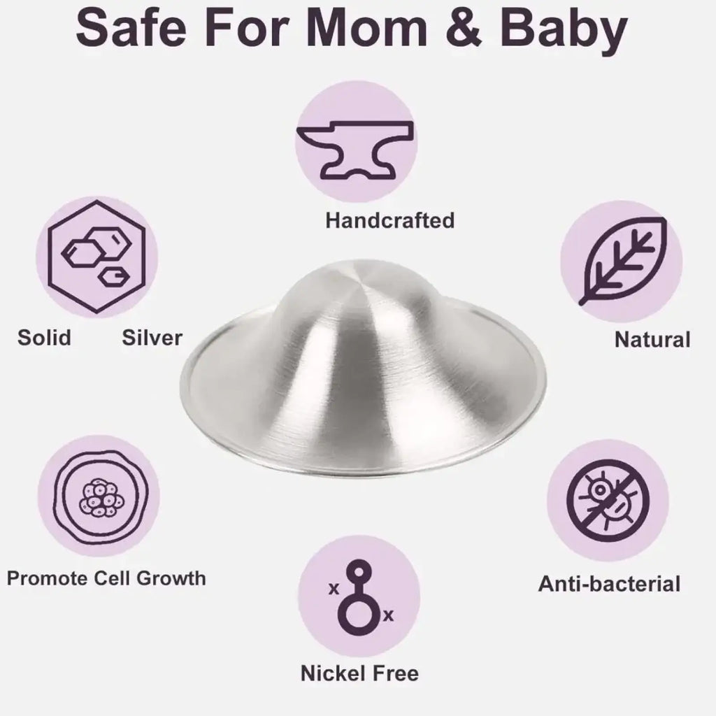 A sleek dome-shaped solid silver nipple shield with polished metallic finish for soothing breastfeeding soreness