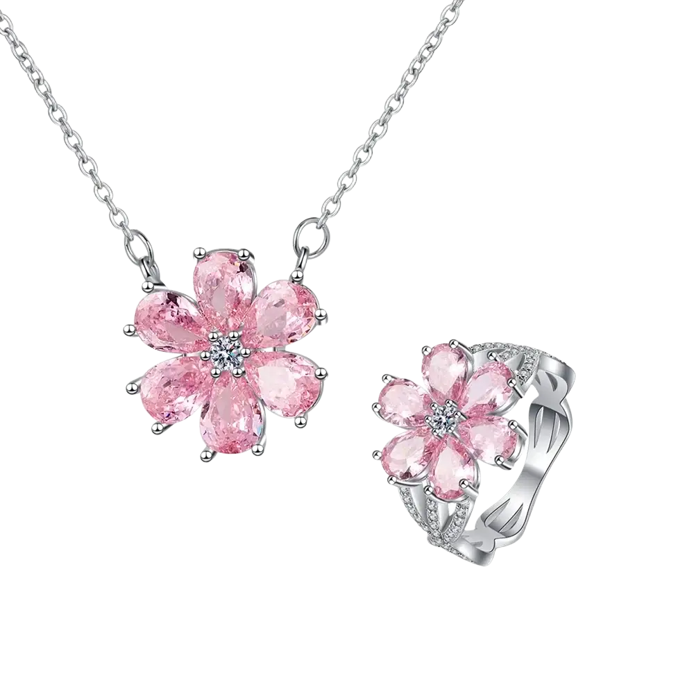 Silver pink cherry blossom jewelry set featuring a silver-toned necklace and ring with pink gemstone flower design