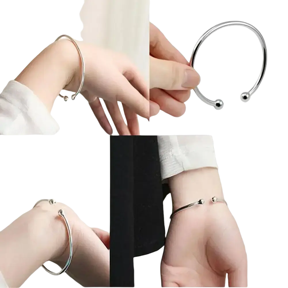 Silver plated adjustable open bangle bracelet with small spherical ends in silver metal finish