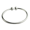 Silver plated adjustable open bangle bracelet with silver-toned polished spherical ends shown from the front