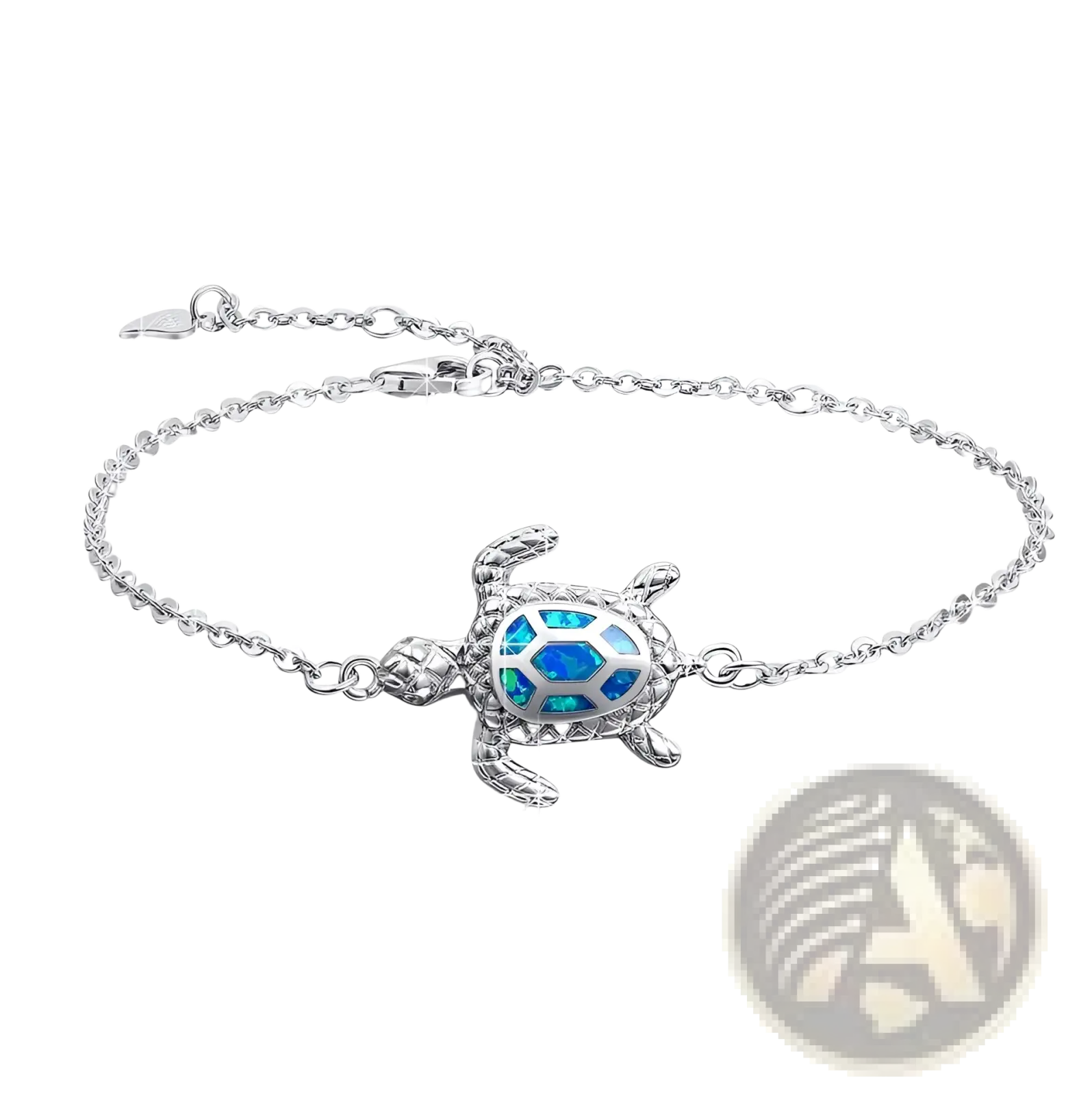Silver sea turtle anklet featuring a silver bracelet with a blue opal inlay on the turtle shell