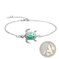 Silver sea turtle opal inlay anklet featuring a silver turtle charm with a green gemstone encrusted shell and delicate chain