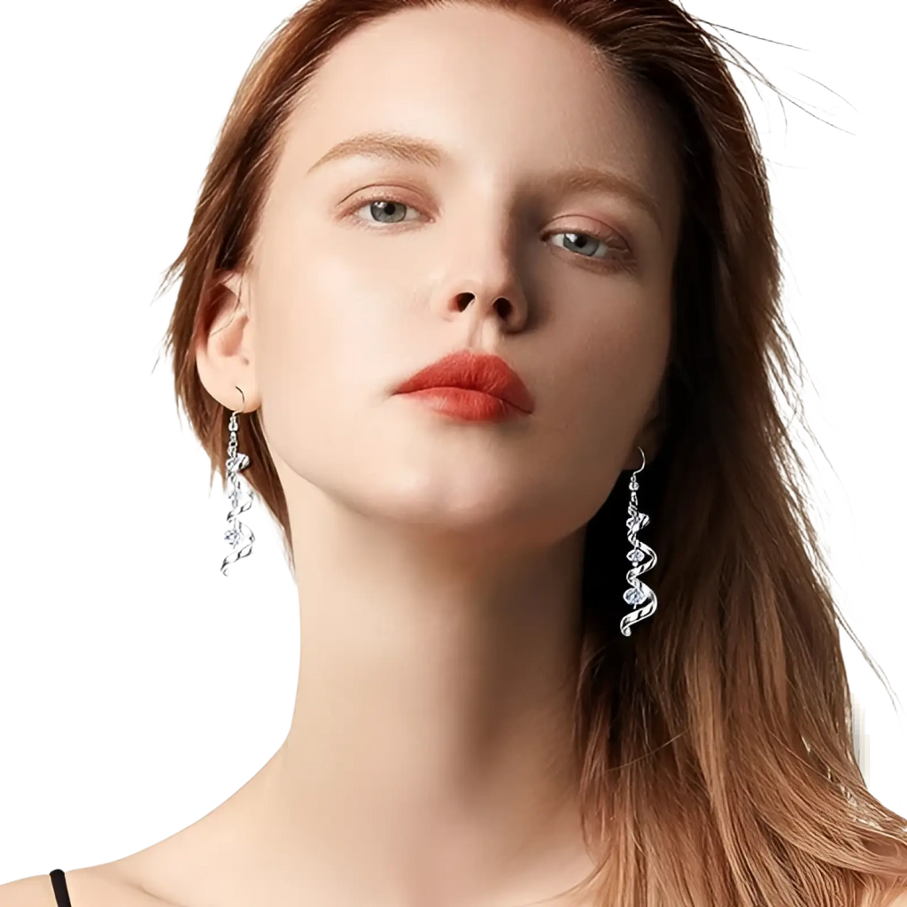 Silver spiral crystal teardrop dangle earrings featuring silver spiral drop design with embedded clear crystals