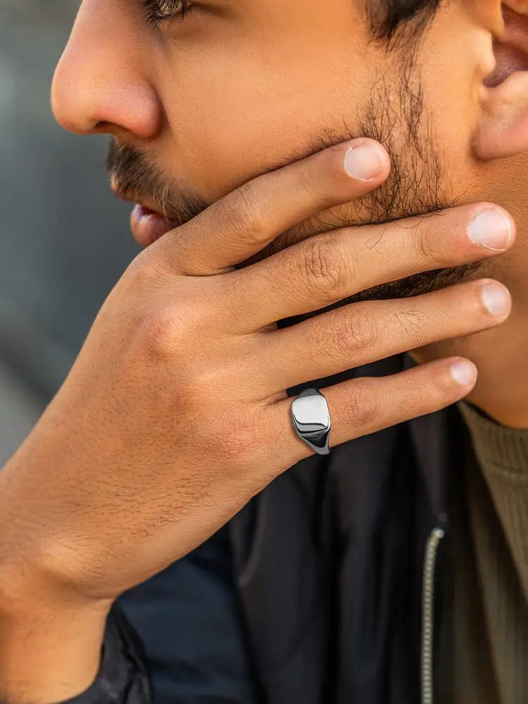 Polished silver square signet ring in 316l stainless steel with a smooth rectangular face and polished finish