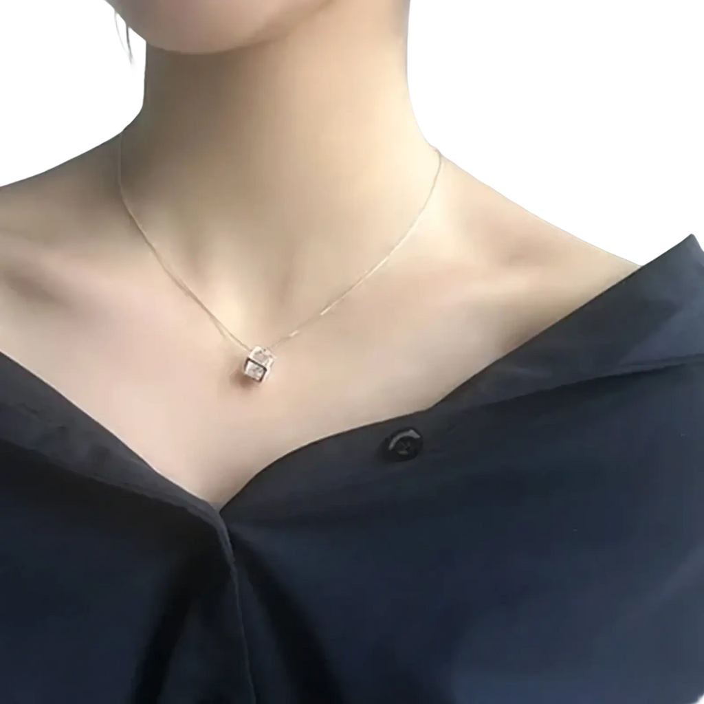 A delicate silver square zircon pendant necklace with sparkling cubic zirconia stones on a fine chain