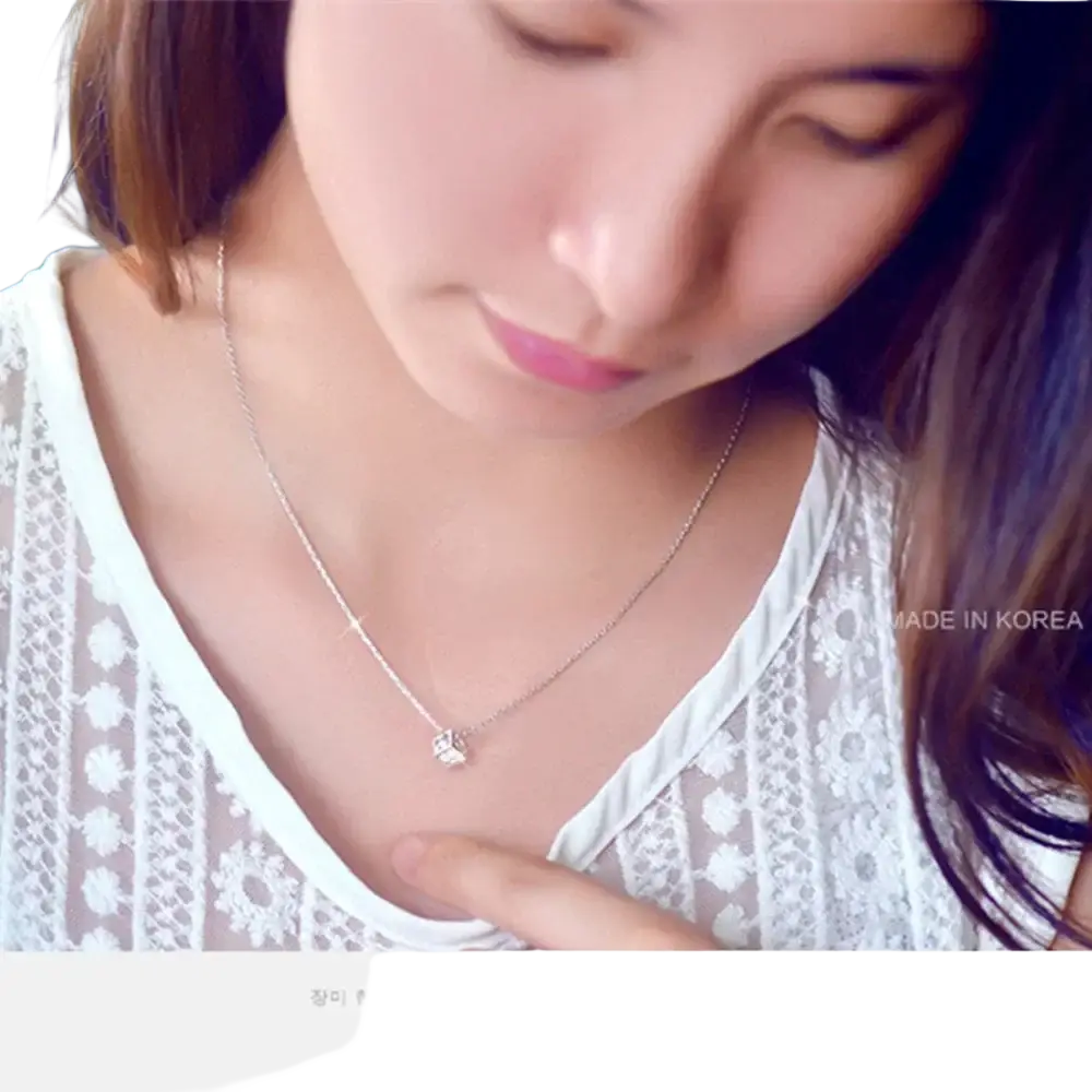 Silver square zircon pendant necklace with a delicate silver chain and a small intricate butterfly pendant