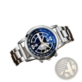 Silver stainless steel quartz chronograph watch with a deep blue dial, white markings, roman numerals, and three sub-dials